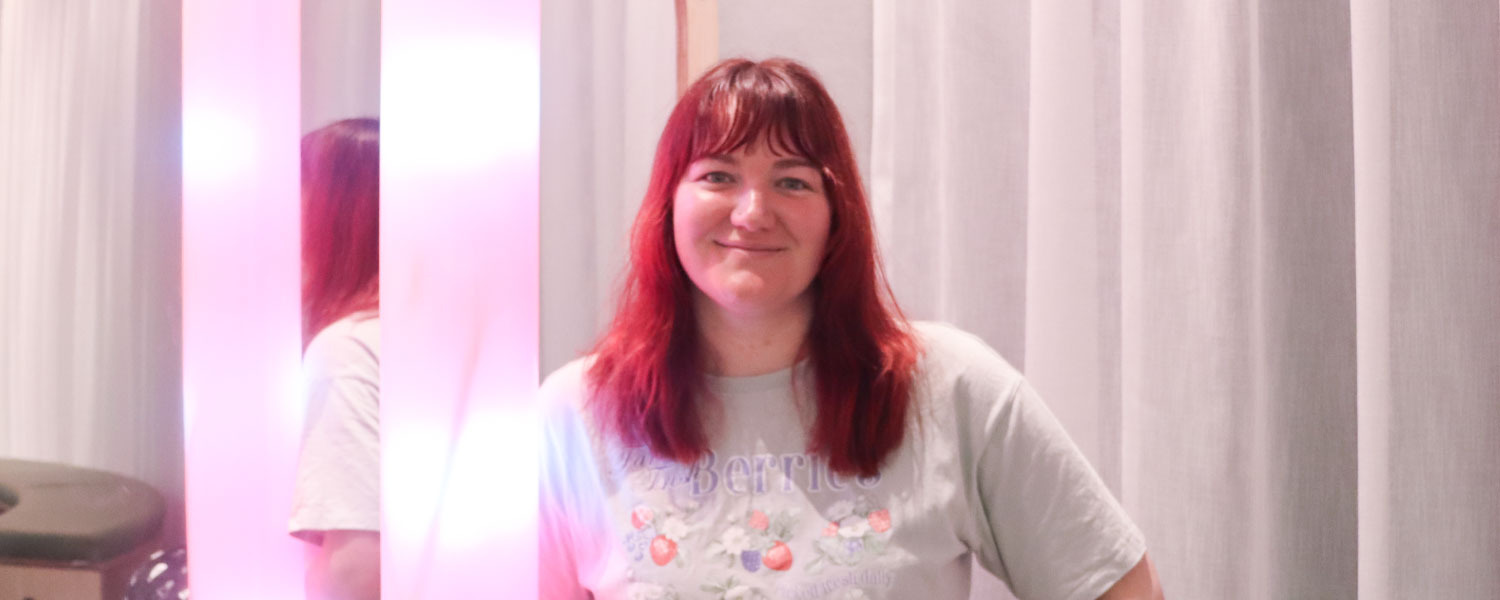 Person using sensory lighting in the Sensory Space.