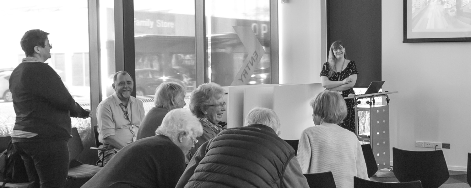 Community members meeting in a shared community space.