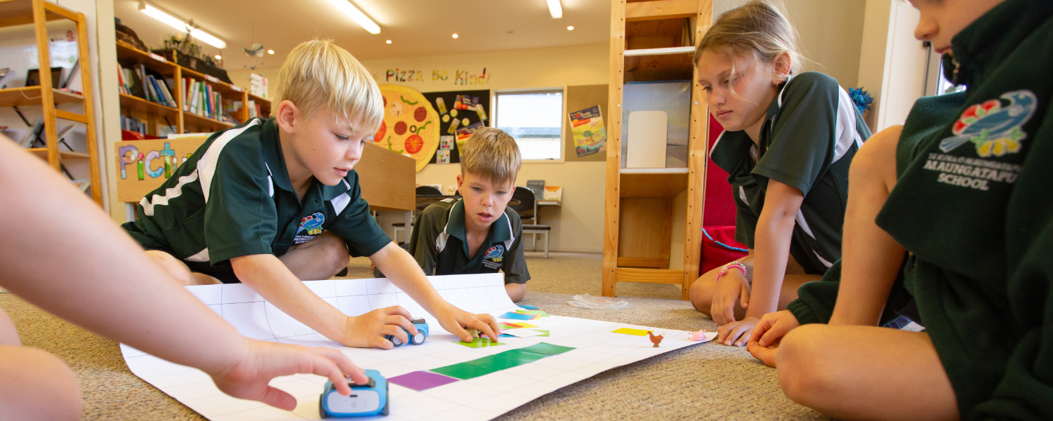 Students taking part in an interactive learning activity during a school outreach visit.