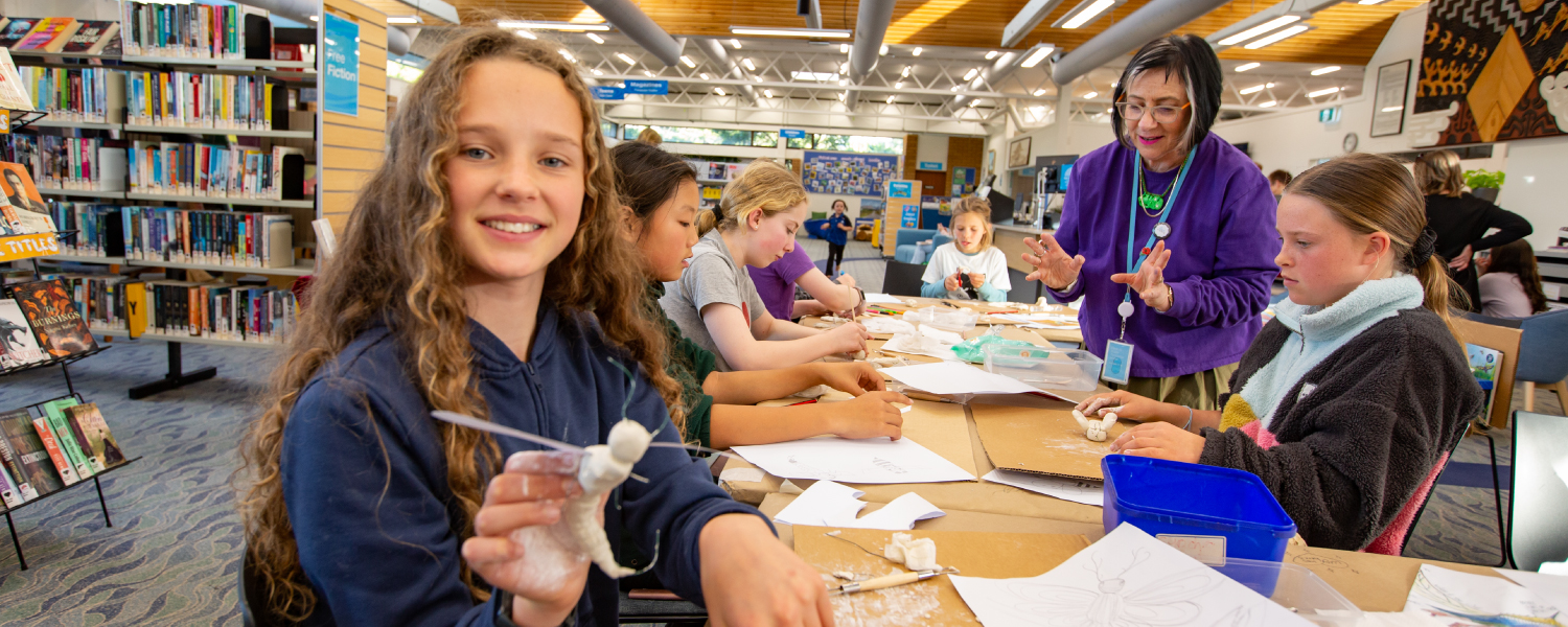 Children taking part in a library craft activity.
